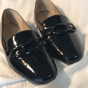 Black flats with black chain embellishments